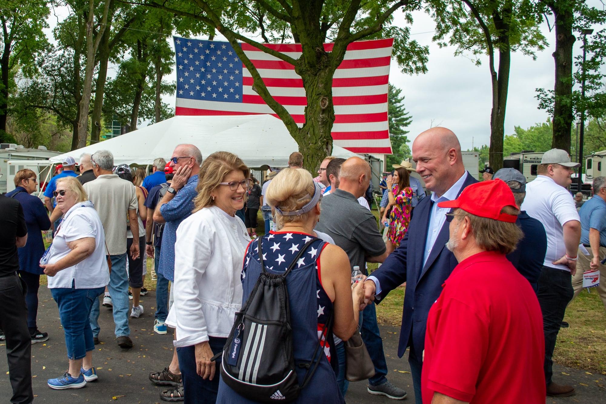 Illinois Republican Party Chair Kathy Salvi (left), and Republican Day guest speaker Matthew Whitaker (right), who served under former President Donald Trump as acting attorney general, greet rally attendees at the Illinois State Fair on Thursday.