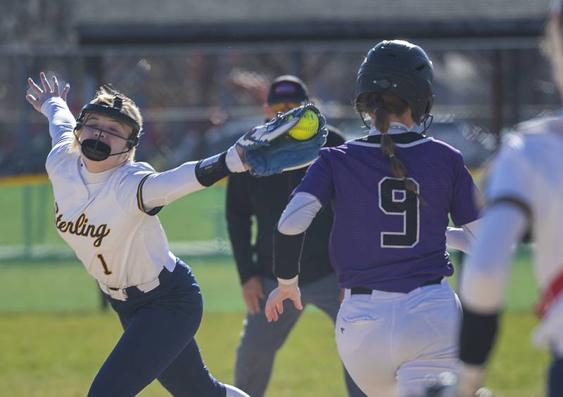 Sterling’s Ady Waldschmidt is pulled off the bag at first as Dixon’s Ava Valk is called safe Tuesday, March 19, 2024 in Dixon.