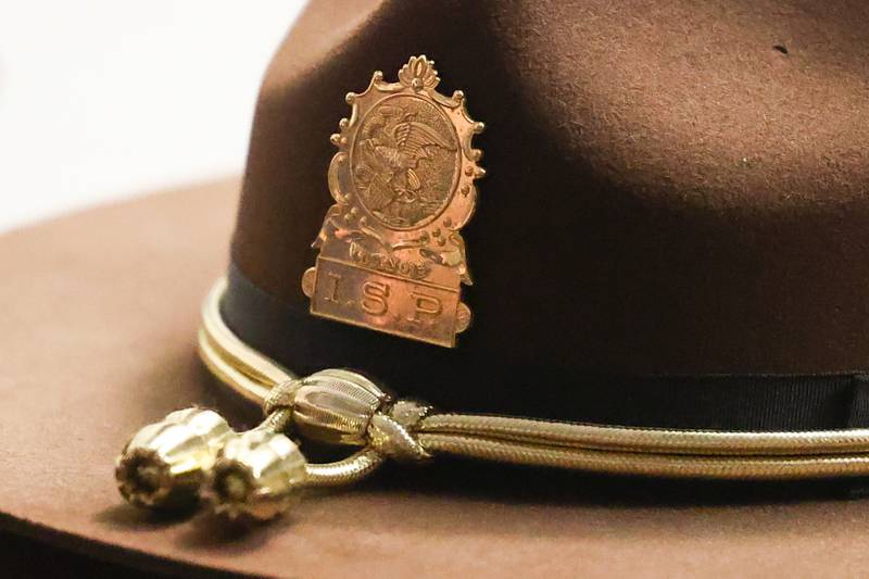 An Illinois State Police hat sits on a dest at press conference held by Will County State’s Attorney James Glasgow on Wednesday for the announcement of Jordan Henry’s 22-year prison sentence after Henry was convicted of aggravated vehicular hijacking, armed robbery, fleeing and other offenses.