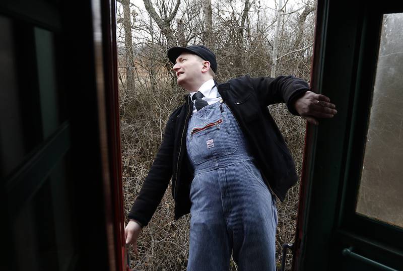 Frank Hicks checks the North Shore train as the train reverses directions Saturday, Jan. 21, 2023, as the Illinois Railway Museum celebrates its 70 anniversary with the first of many celebrations by commemorating the 60 years since the abandonment of the Chicago North Shore and Milwaukee Railroad.