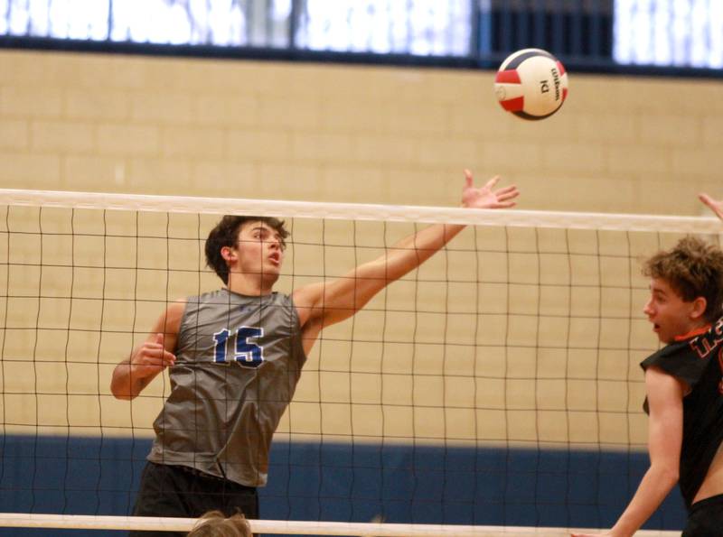 Geneva’s Ryan Fioresi reaches for the ball during a game against Wheaton Warrenville South at Geneva on Tuesday, April 2, 2024.