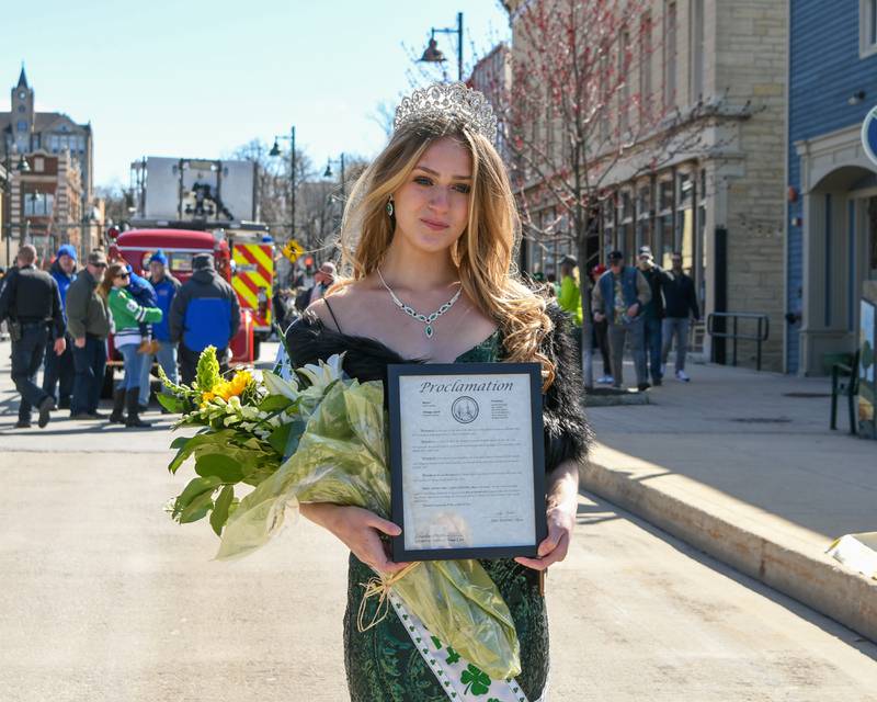 Brayah Bromberck poses with her Proclamation plaque on March 9, 2024, as she was crowned the 2024 St. Patrick’s Parade queen in downtown Lemont.