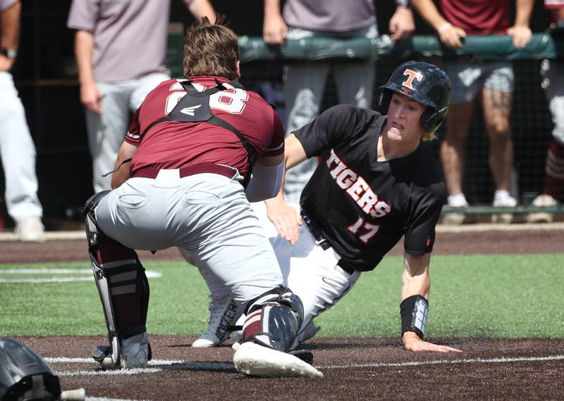 Morris' Griffin Zweeres tags out Crystal Lake Central's Connor Gibour trying to score during their Class 3A state semifinal game Friday, June 7, 2024, at Duly Health and Care Field in Joliet.