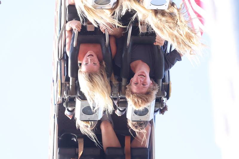 Makynley Schneider, left, and Aaron Freidt brave the new Fireball ride at the Taste of Joliet on Friday, June 21, 2024 at Joliet Memorial Stadium.