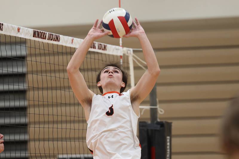Lincoln-Way West’s Noah Konopack sets the ball against Minooka on Monday, April 8, 2024.