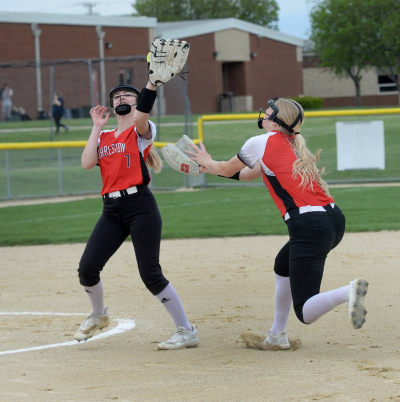 Forreston's Isabella Thiel (left) and Ella Ingram go after a pop fly during a Thursday, May 2, 2024 game against Polo at Forreston High School.