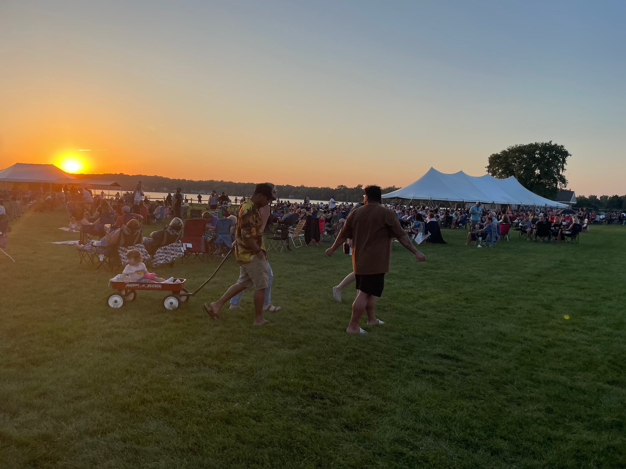 The sun sets over McCullom Lake during Bands, Brews & BBQ last year. This year's event is Aug. 16-18 at Petersen Park, McHenry.