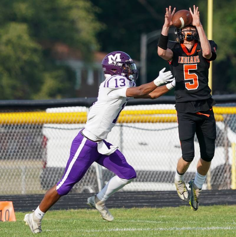 Sandwich Cole Leeper (5) intercepts a pass intended for Manteno’s Porter Chandler (13) during a football game at Sandwich High School on Saturday, Aug 26, 2023.
