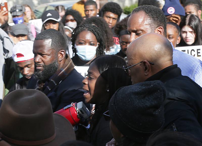 Carmen Day, (center) mother of Jelani Day, speaks to a crowd of people at the Illinois Valley YMCA in Peru on Tuesday Oct. 26, 2021.