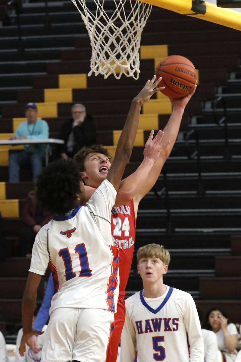 Marian Central's Christian Bentancur drives to the basket against Hoffman Estates’ DJ Wallace during a Hinkle Holiday Classic basketball game Tuesday, Dec. 27, 2022, at Jacobs High School in Algonquin.