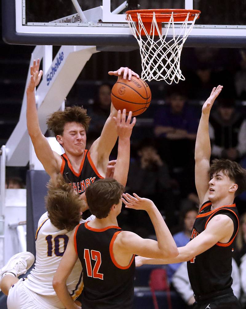 McHenry's Dylan Hurckes blocks Hononegah's Cole Warren shot during the IHSA Class 4A Guilford Boys Basketball Sectional semifinal game on Wednesday, Feb. 28, 2024, at Rock Valley College in Rockford.