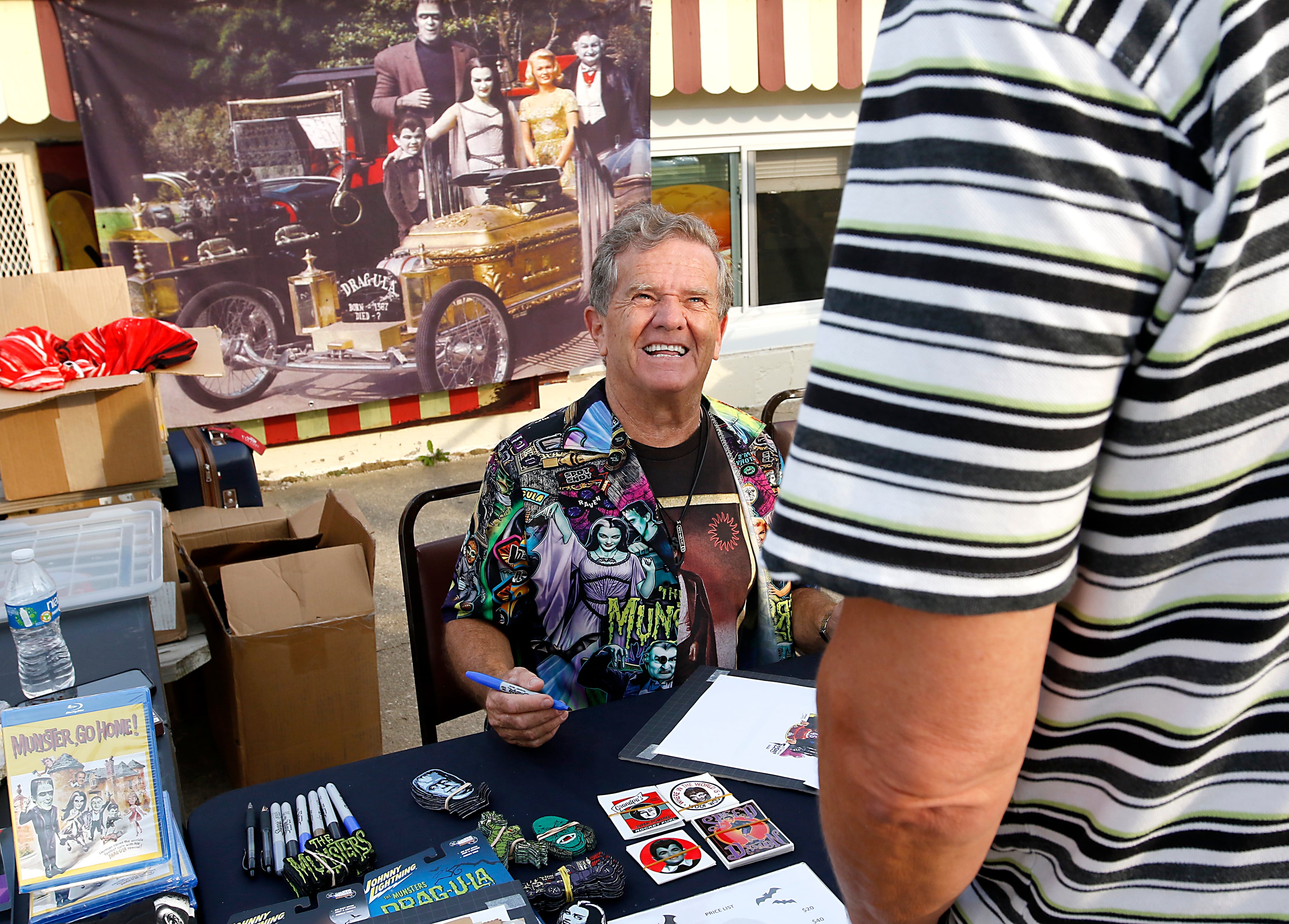 Butch Patrick, who played Eddie Munster on the 1960s show “The Munsters” signs autographs, Wednesday, Aug. 14, 2024, during an appearance at the McHenry Outdoor Theater.