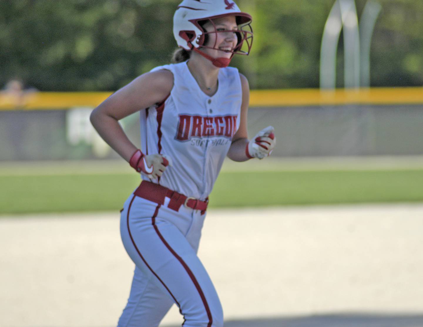 Oregon's Hayleigh Heuerman is all smiles after belting a home run against Rock Falls on Monday, May 6, 2024 in Rock Falls.