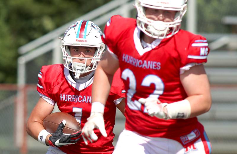 Marian Central’s Andrew Thielsen, right, guides the way as Eddie Kowalczyk, left, looks for running room against Bishop McNamara in varsity football action on Saturday, Sept. 14, 2024, at George Harding Field on the campus of Marian Central High School in Woodstock.