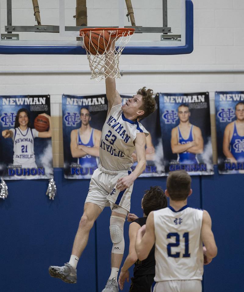 Newman’s Lucas Simpson stuff in a dunk against AFC Monday, Feb. 19, 2024 in a regional quarterfinal game at Newman High School.