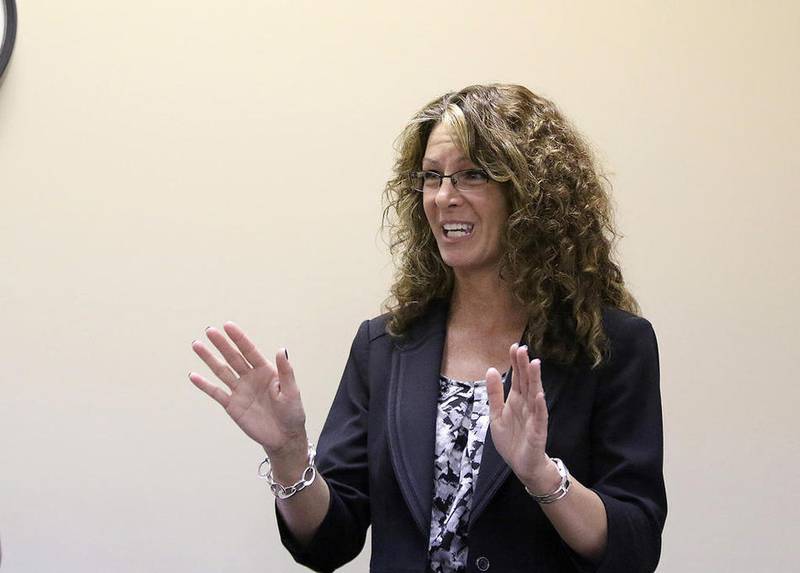 Newly named DeKalb High School Principal Michele Albano introduces herself at the District 428 school board meeting in DeKalb following the hiring approval on Tuesday, April 19, 2016.