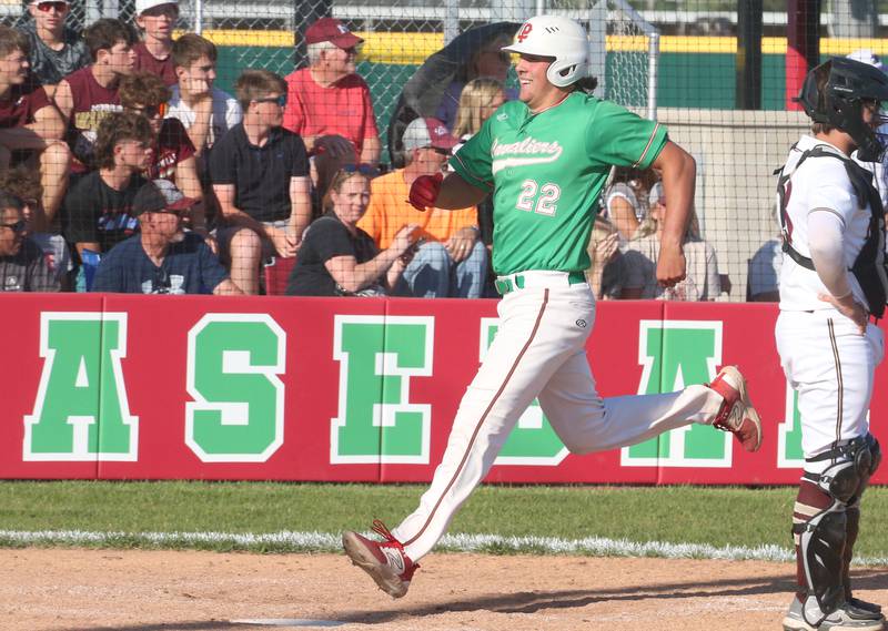 L-P's Josh Senica smiles after scoring a run against Morris during the Class 3A Regional semifinal game at Huby Sarver Field in La Salle.