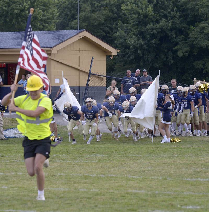 The Marquette Crusaders take the field for their home opener Friday against Aurora Christian.