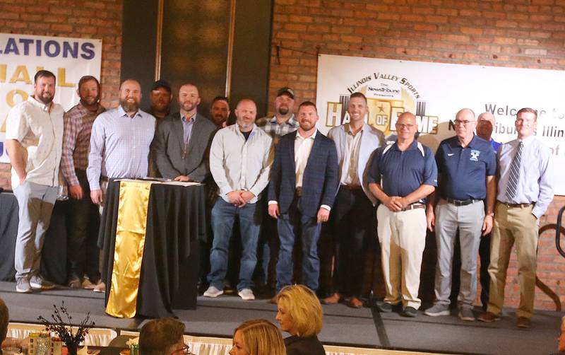 Members of the 2005 Bureau Valley High School football team pose for a photo during the  Illinois Valley Sports Hall of Fame awards banquet on Thursday, June 6, 2024 at the Auditorium Ballroom in La Salle.