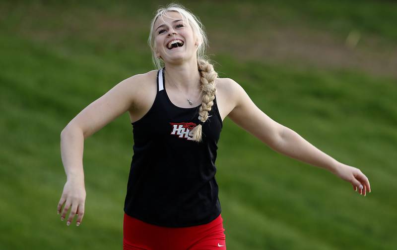 Huntley’s Ally Panzloff laughs after stepping out of the ring while throwing the shot putt Friday, May 5, 2023, during the Fox Valley Conference Girls Track and Field Meet at Huntley High School.