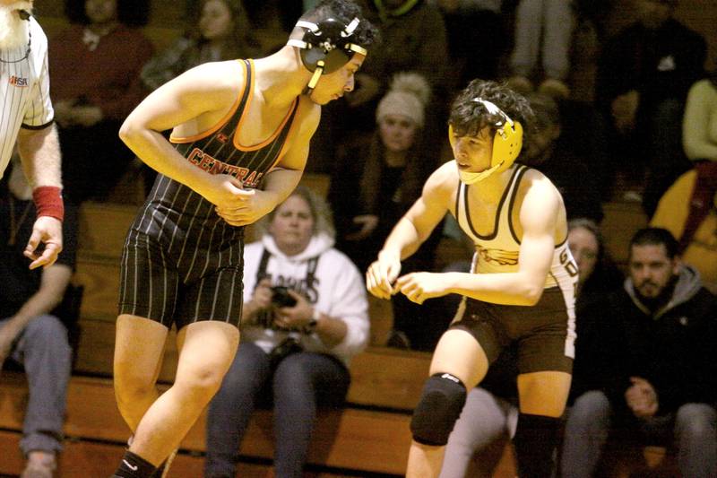 Jacobs’ Dom Ducato, right, battles Crystal Lake Central’s Ramiro Rendon at  120 pounds in varsity wrestling Thursday at Algonquin.