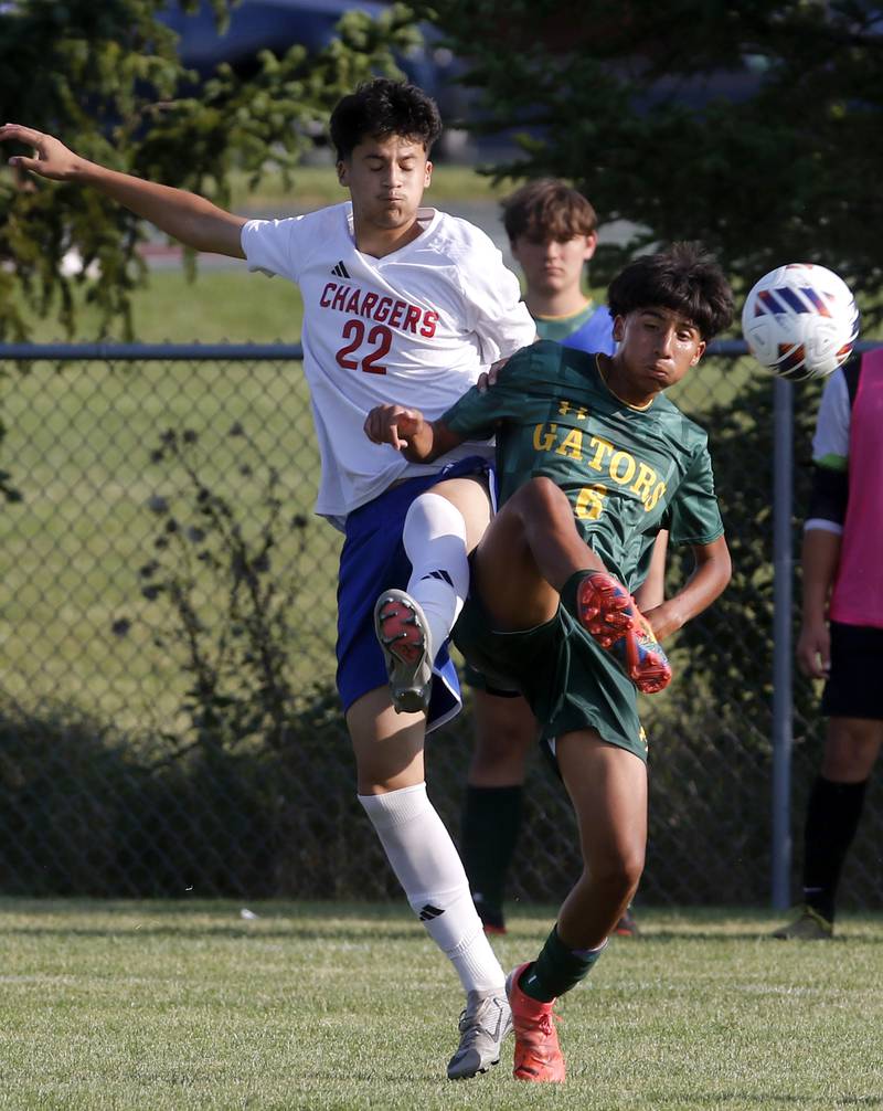 Crystal Lake South's Hayden Stone kicks the ball away from Dundee-Crown's Giovanny Perez during a Fox Valley Conference soccer match on Tuesday, Sept. 10, 2024, at Crystal Lake South High School.