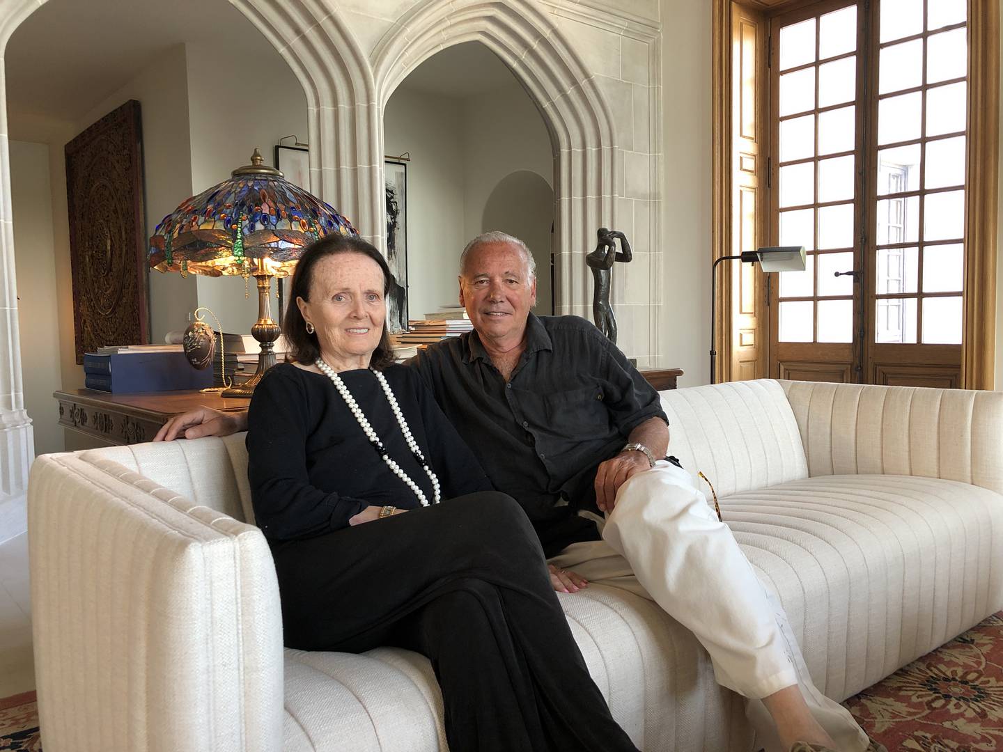 Henri and June Giugni on Thursday, Sept. 12, 2024, at their home outside Harvard. The couple plans to sell the English style manor house and build a smaller, one-level home nearby.