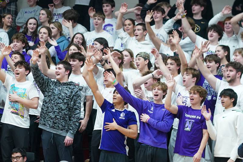 Downers Grove North fans in wave bye to the Waubonsie Valley student section after Downers Grove North takes a large lead late in the 4th quarter during a Class 4A East Aurora sectional semifinal basketball game at East Aurora High School on Wednesday, Feb 28, 2024.