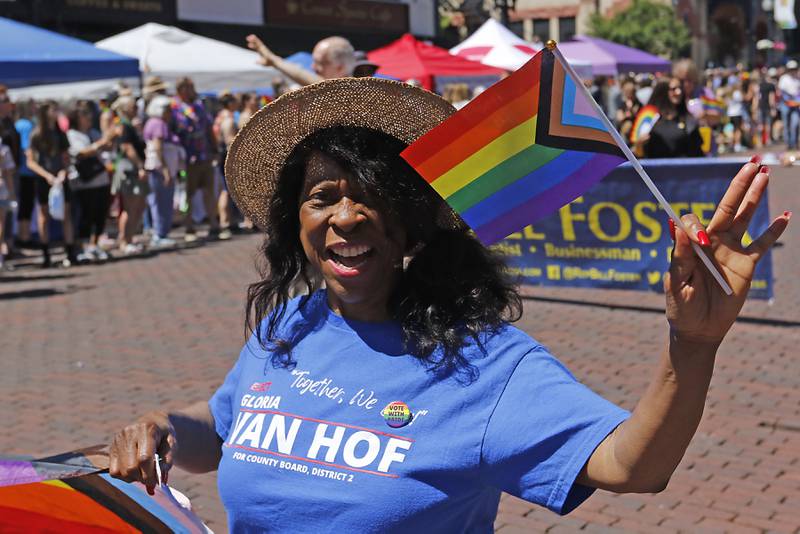 McHenry County Board member Gloria Van Hof waves to the crowd during the Woodstock PrideFest Parade on Sunday, June 9, 2024, around the historic Woodstock Square.