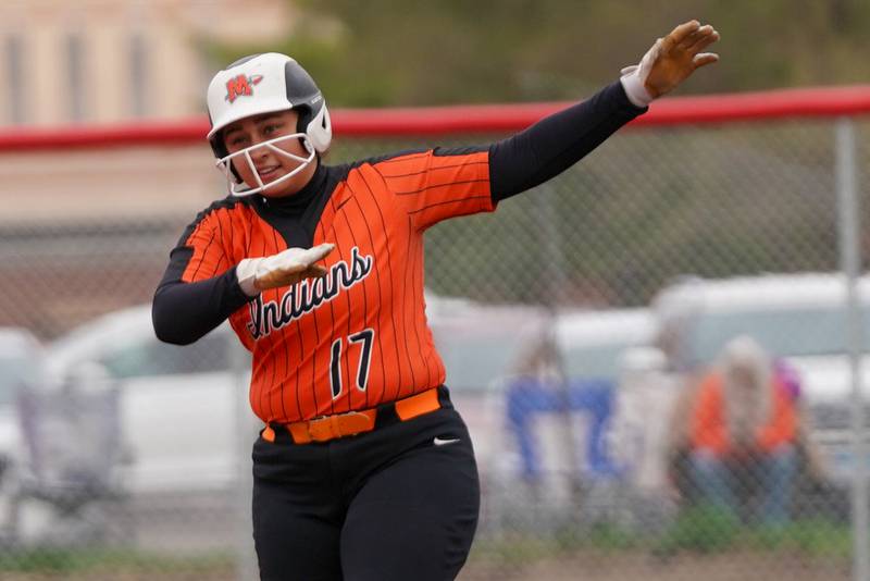 Minooka’s Jaelle Hamilton (17) celebrates after hitting a single against Yorkville during a softball game at Yorkville High School on Thursday, April 11, 2024.