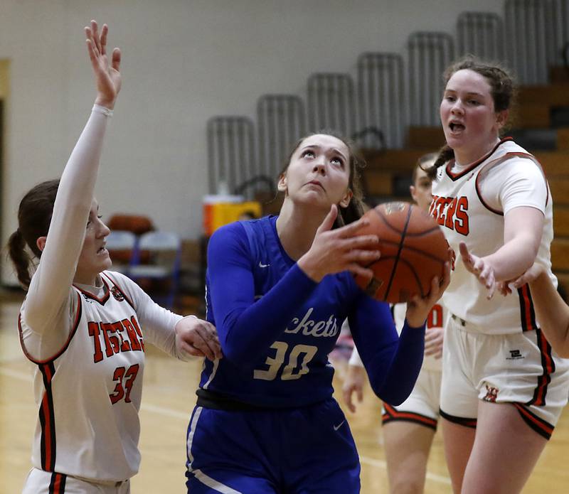 Burlington Central's Emma Payton drives to the basket against Crystal Lake Central's Katie Hamill during the IHSA Class 3A Woodstock Regional Championship girls basketball game on Thursday, Feb. 15, 2024, at Woodstock High School.