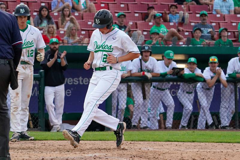 York's Paul Reedy (21) scores on a McHenry wild pitch during a class 4A Kane County supersectional baseball game at Northwestern Medicine Field in Geneva on Monday, June 3, 2024.