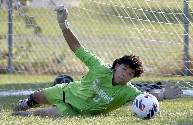 Dundee-Crown's Imanol Soriano dives as he tries to stop a goal during a Fox Valley Conference soccer match Crystal Lake South on Tuesday, Sept. 10, 2024, at Crystal Lake South High School.