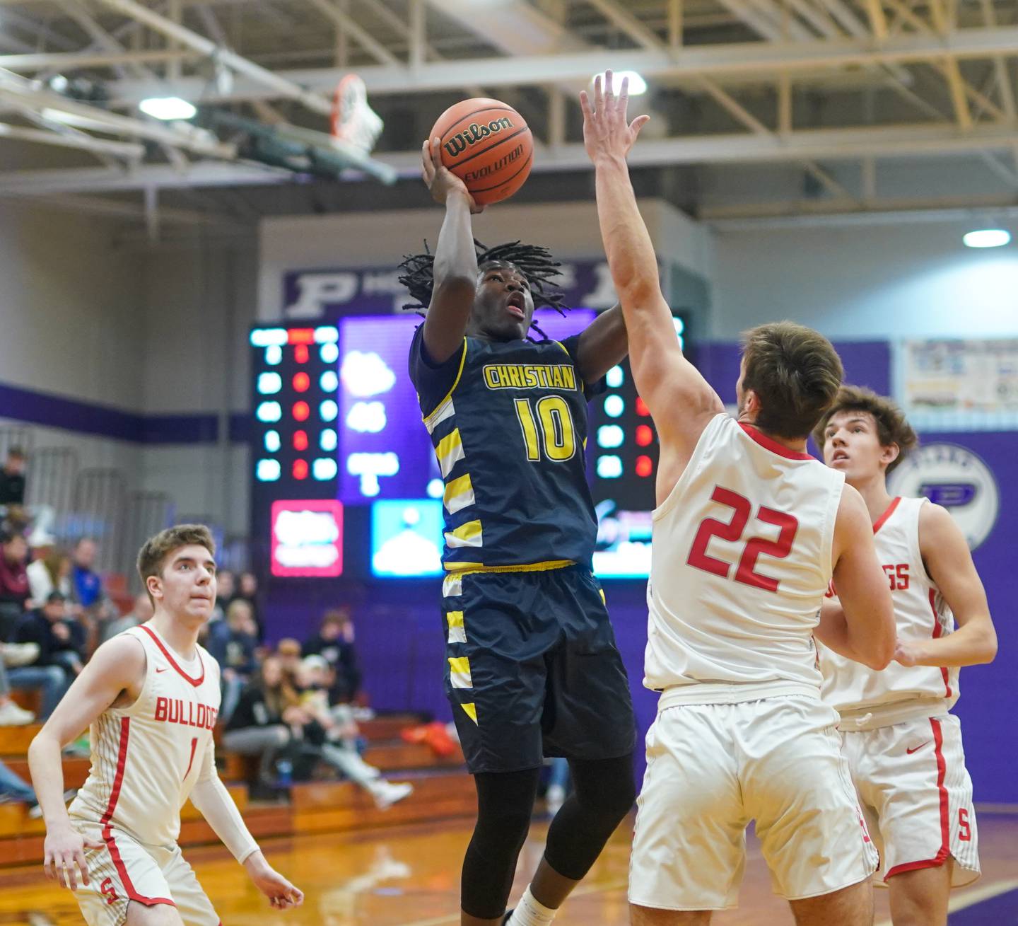 Yorkville Christian's Jayden Riley (10) shoots the ball in the post over Streator's Christian Benning (22) during the 60th annual Plano Christmas Basketball Tournament Plano High School on Wednesday, Dec 27, 2023.