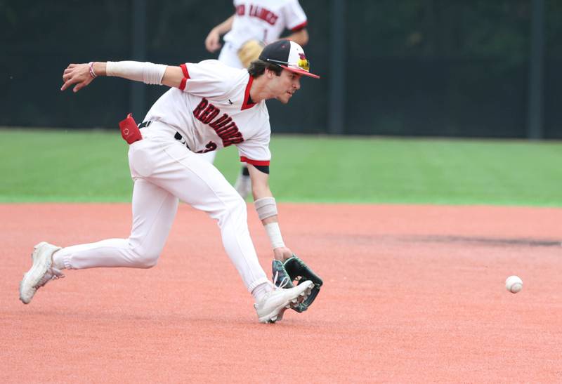 Huntley's Griffin Goldstein charges a grounder during their Class 4A DeKalb Regional championship game against DeKalb Friday, May 24, 2024, at Ralph McKinzie Field at Northern Illinois University in DeKalb.