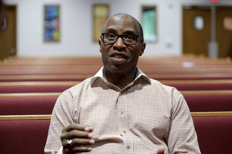 Dr. Craig Tatum, pastor for New Life Baptist Church Ministries, talks about voting in the November presidential election, Tuesday, July 9, 2024, in Saginaw, Mich. President Joe Biden says the pressure on him to end his reelection campaign is coming from Democratic Party “elites." But a sampling of voters and Democratic activists in several key swing states paints a far more complicated picture in the aftermath of Biden’s disastrous debate performance. Tatum says many people he speaks with found Biden’s performance troubling but remain committed to voting Democratic after seeing Trump’s presidency and character. (AP Photo/Al Goldis)