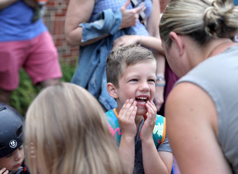 Kindergartner Cody Doyle smiles at his mom, Kristen, on the first day of school at Whittier Elementary School in Downers Grove on Friday, Aug. 25, 2023.