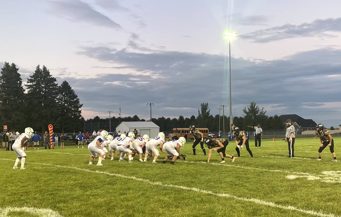 The Flanagan-Cornell/Woodland defense, at right, lines up against Peoria Heights on Friday, Sept. 6, 2024, in Flanagan.