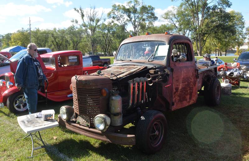 Guy Quandt of Rock Falls looks at a "Rat Rod" owned by Bob Renwick of Rockford at the Focus House Foundation Car Show held during Autumn on Parade on Satirday, Oct. 7, 2023 in Oregon.