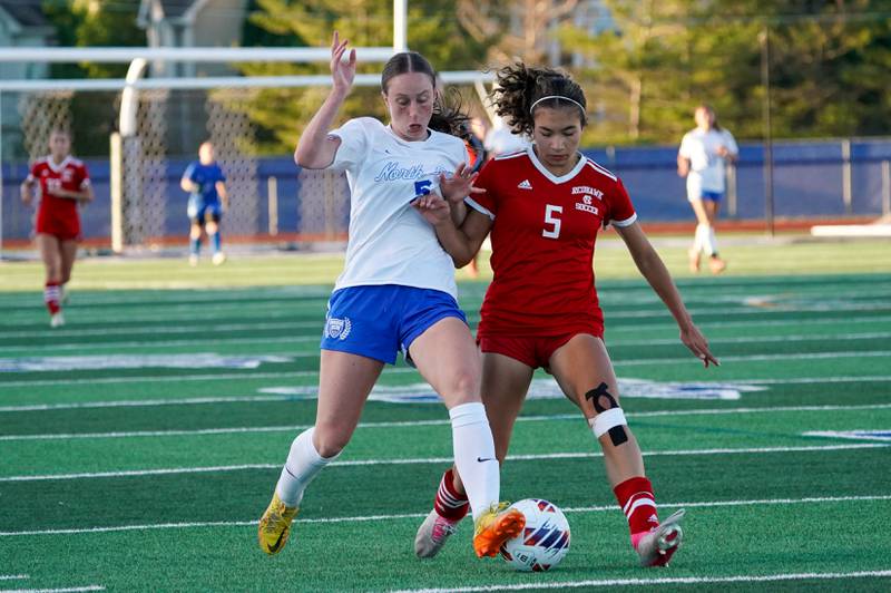 Naperville Central's Eleanor Kane (right) challenges St. Charles North's Rian Spaulding (left) for the ball during a Class 3A St. Charles North Supersectional soccer final match at St. Charles North High School on Tuesday, May 28, 2024.