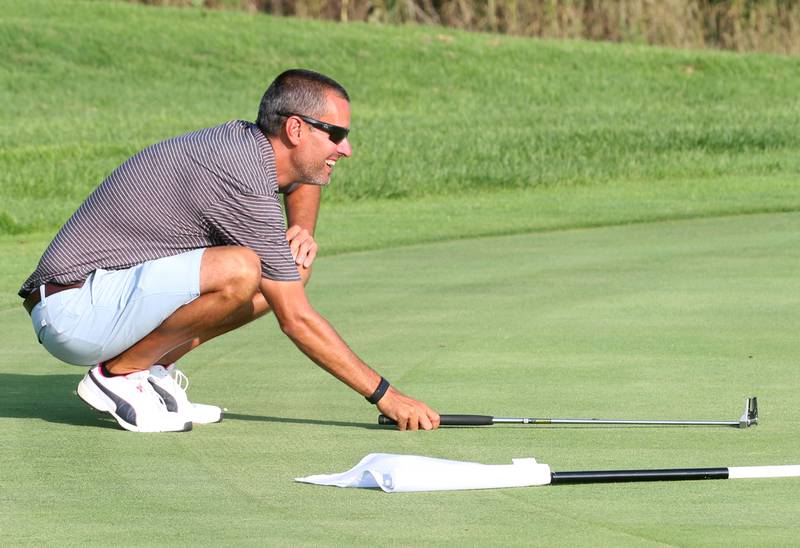 TJ Templeton lines up a putt on the 17th hole during the Illinois Valley Men's Golf Championship on Sunday, July 28. 2024 at Mendota Golf Club.