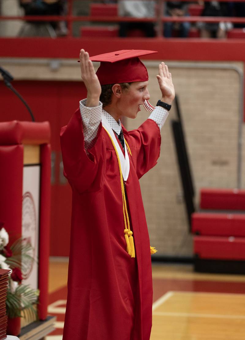 Senior Class President Sullivan Walker leads the Ottawa High School Class of 2024 in moving their tassels to the left side of their caps, signifying they have graduated.