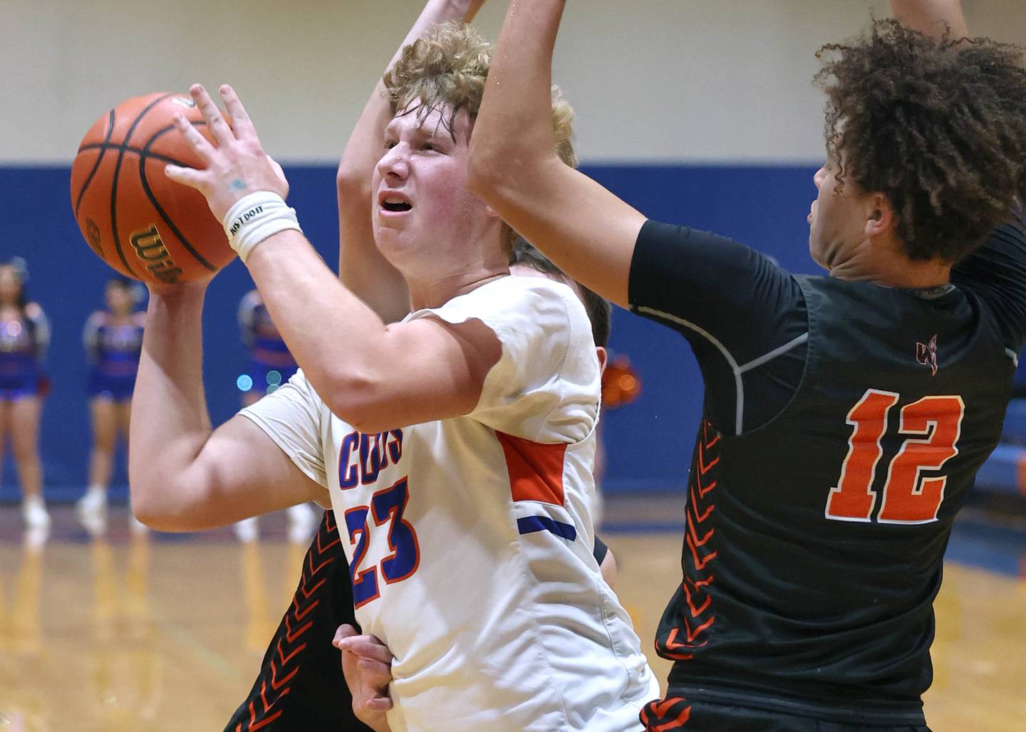 Genoa-Kingston's Hayden Hodgson gets between two Winnebago defenders for a shot during their game Tuesday, Jan. 30, 2024, at Genoa-Kingston High School.