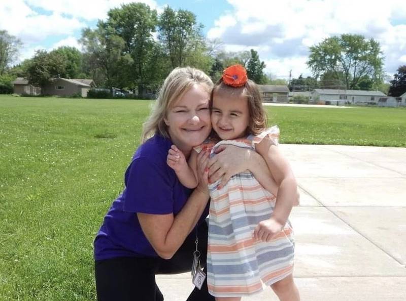 Kendall County para-educator Brenda Holzer (left) with former student, Meadow Klingen (right).