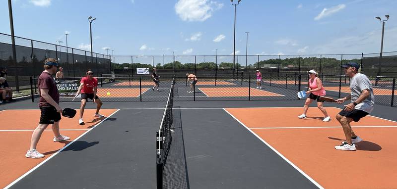 Phil Janssen and Caleb Young of Dakota (left) battle Rich and Candy VanWambeke of Machesney Park during ByronFest's inaugural pickleball tournament on Saturday, July 13, 2024 in Byron.