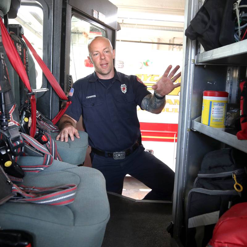 Ian Wheeler, a Sycamore firefighter/paramedic, talks Tuesday, June 11, 2024, at Sycamore Fire Station 1, about the items carried aboard one of the engines.The department recently released their annual report and one of the items highlighted was the departments need for a ladder truck.