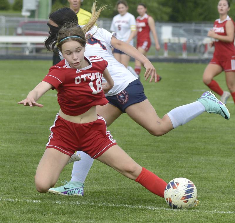 Ottawa’s Chloe Carmona looses her footing while chasing for control with Depue’s Kaylee Paz during match Thursday at Ottawa