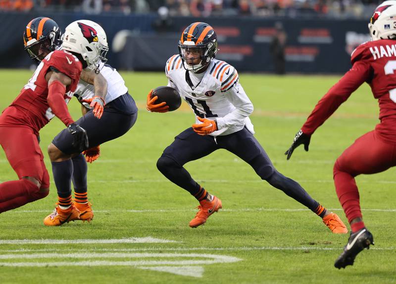 Chicago Bears wide receiver Darnell Mooney looks to pick up yardage after a wide receiver screen during their game against the Arizona Cardinals Sunday, Dec. 24, 2023, at Soldier Field in Chicago.