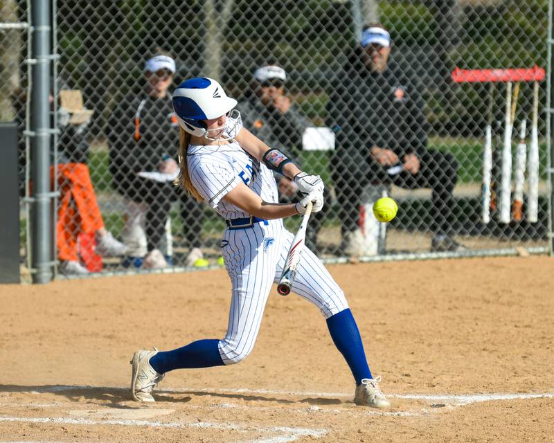 Wheaton North's Makayla Hammer (11) gets a double during the game against Wheaton Warrenville South on Friday April 19, 2024.