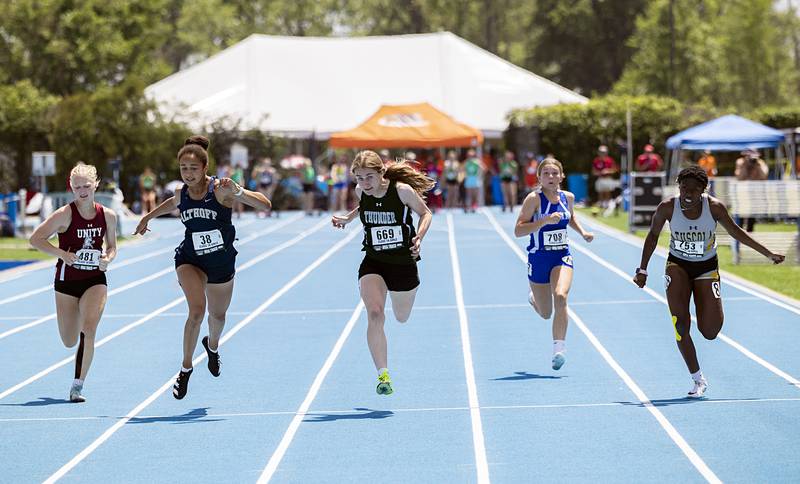 West Carroll’s Emma Randecker (middle) wins the 1A 100 dash title Saturday, May 18, 2024 at the IHSA girls state track meet in Charleston.